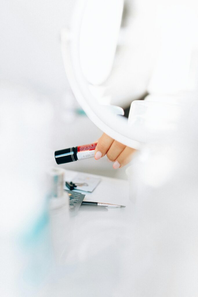 A close-up of makeup tools and cosmetics on a vanity table. Ideal for beauty and fashion themes.